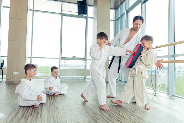 istock young, beautiful, successful multi ethical kids in karate positi 618213920