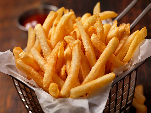Basket of Famous Fast Food French Fries stock photo
