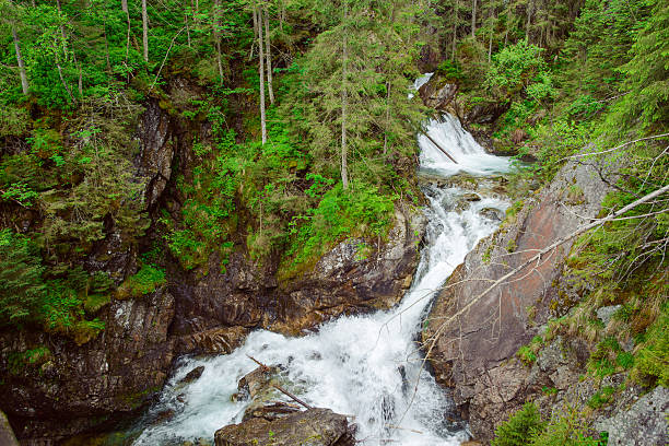 istock Mountains and meadows with a small creek 618215628