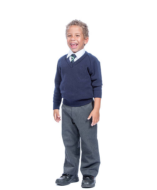 istock Happy Young Biracial Boy In School Uniform 618217502