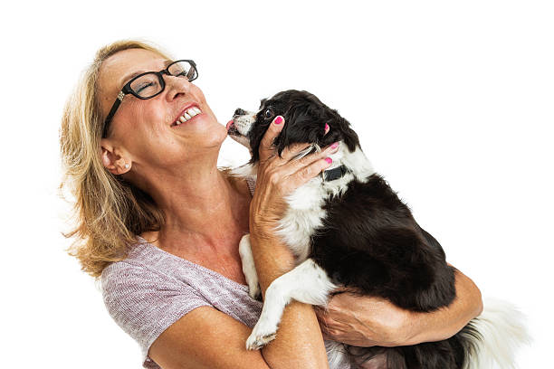 istock Laughing Woman With Affectionate Dog 618218050