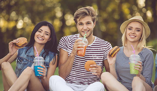 istock Friends resting in park 618218646