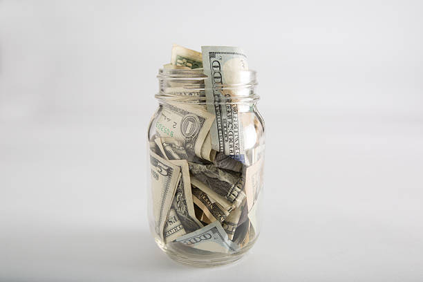 istock Mason jar with money and different dollar amounts 618218684
