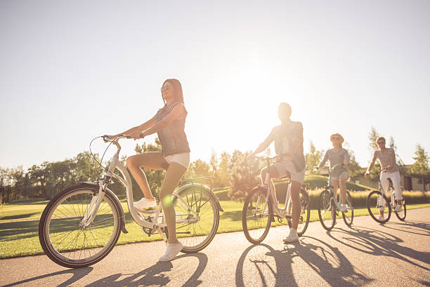 istock Friends cycling in park 618219370
