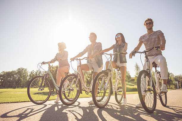istock Friends cycling in park 618220474