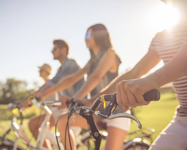 istock Friends cycling in park 618220770