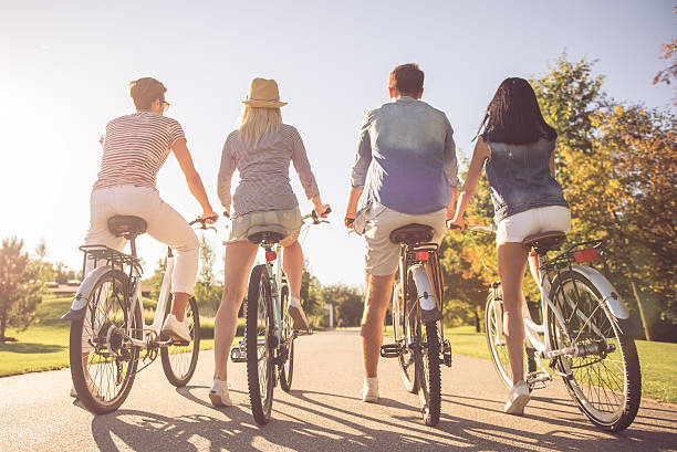 istock Friends cycling in park 618221290