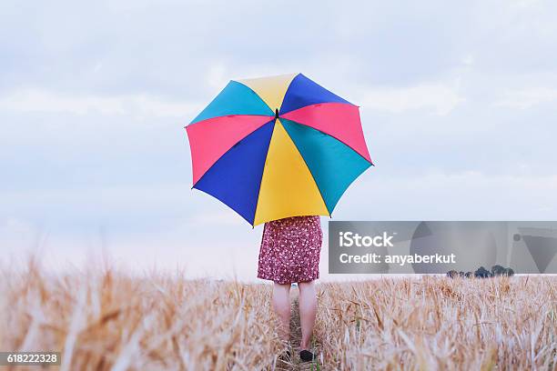 Woman With Colorful Umbrella Stock Photo - Download Image Now - Umbrella, Agricultural Field, Women