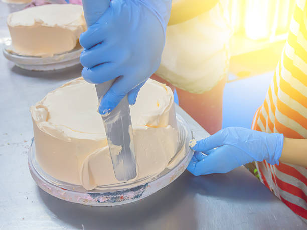 istock women making cake in cake industry 618224608