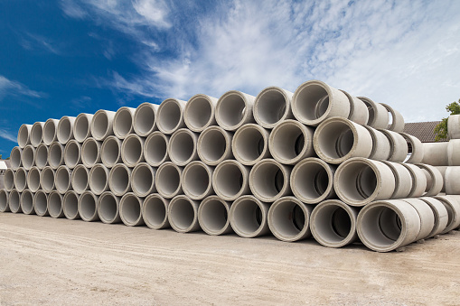 Stack of concrete drainage pipes for wells and water discharges