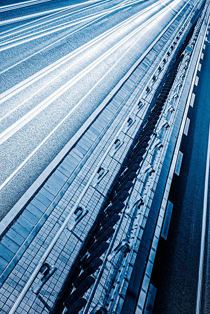 istock urban traffic road with light trails 618225536