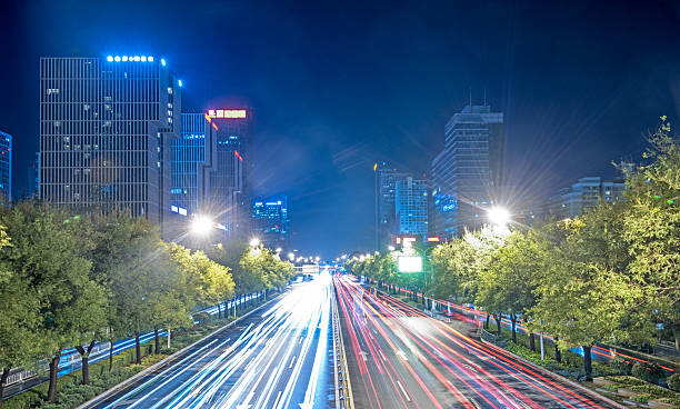 istock blurred traffic light trails on road at night 618225624