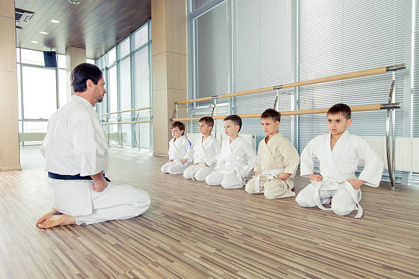 young, beautiful, successful multi ethical kids in karate positi