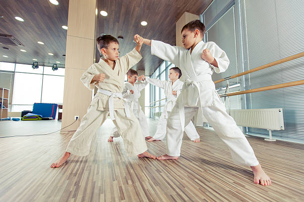 istock young, beautiful, successful multi ethical kids in karate positi 618225728