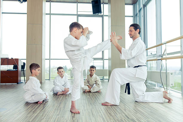 istock young, beautiful, successful multi ethical kids in karate positi 618225828