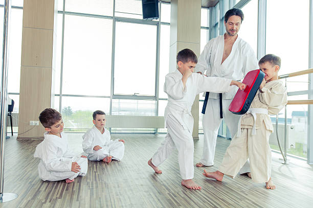 istock young, beautiful, successful multi ethical kids in karate positi 618225864