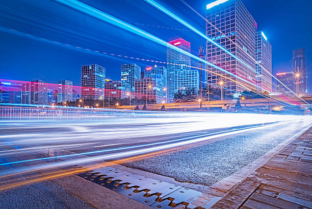 istock blurred traffic light trails on road at night 618315506