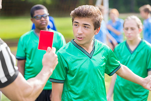 istock Male soccer player talks with referee about penalty call 618317700