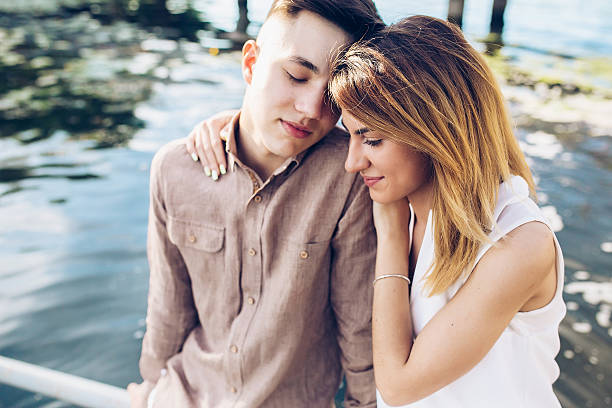 istock man and woman posing on the lake 618318764