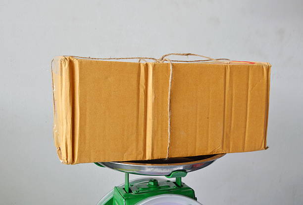 istock brown postbox on weighing scale tray in shop 618318876