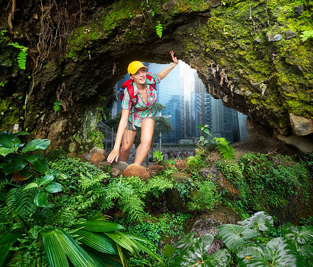 Woman traveler runs away from the city bustle to clean and beautiful rain forest