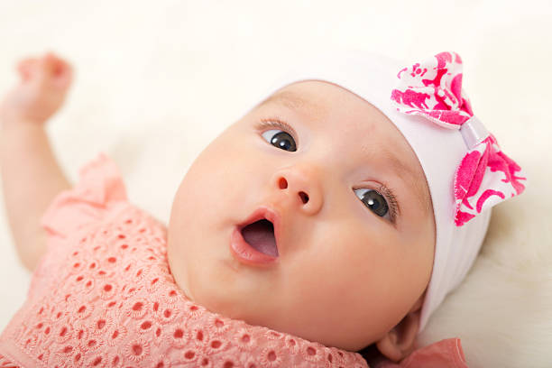 istock Cute baby girl lying on her back 618322644