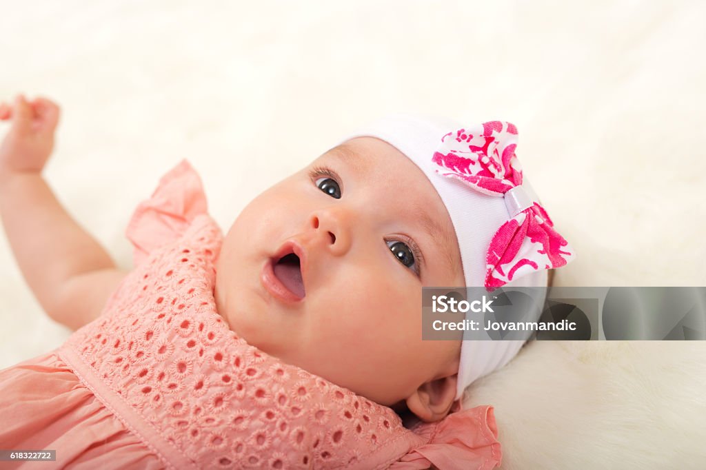 Cute Baby Girl Lying On Her Back Stock Photo - Download Image Now - 0-11  Months, Babies Only, Baby - Human Age - iStock