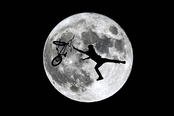 istock Full moon free rider jumping 618322736