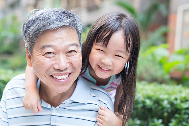 istock old man with granddaughter 618322868