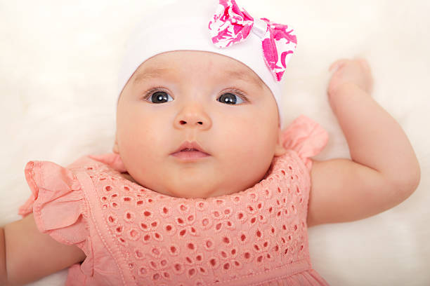 istock Cute baby girl lying on her back 618323092