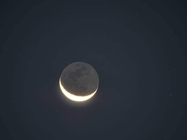 istock Earthshine of a crescent moon 618323438