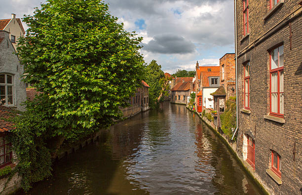 istock Historical gothic buildings by water channels at brugge belgium 618323634