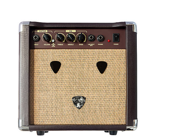 istock Small acoustic guitar amplifier with pick guitar on amplifier ma 618323712