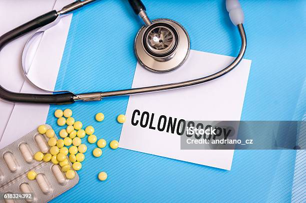 Colonoscopy Word Written On Medical Blue Folder Stock Photo - Download Image Now - Colonoscopy, Science, Blue