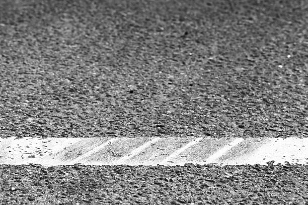 istock Dividing line with tire tracks over it 618326082