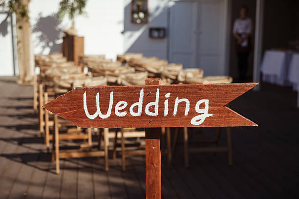 istock Beautiful outdoor wedding ceremony arrow sign 618326340