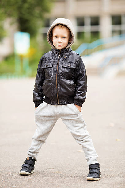 istock little urban boy wearing leather jacket 618326360