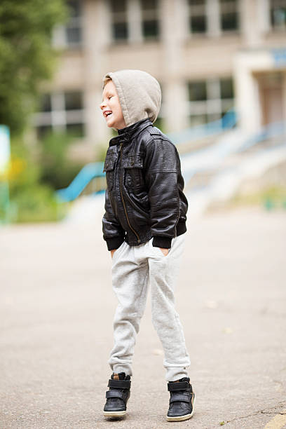 istock Kid jumping and having fun outdoors 618326556