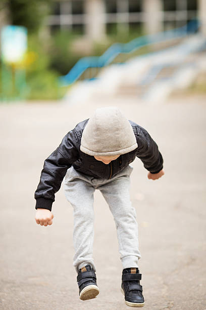 istock Kid jumping and having fun outdoors 618326740