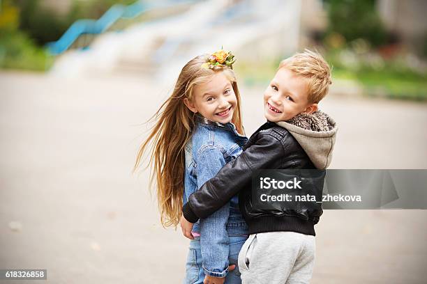 Portrait Of A Happy Children Boy And Girl Stock Photo - Download Image Now - Boys, Child, Girls