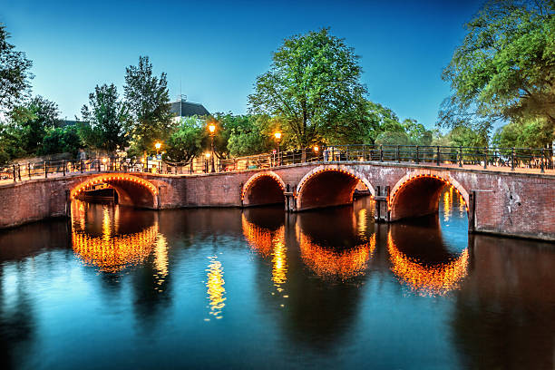 istock Canal in Amsterdam at night 618327866