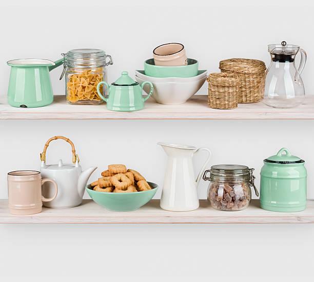 istock Kitchen shelves interior with utensils and food ingredients on white 618329646