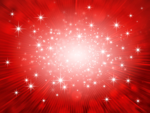 Festive bright light exploding inside a glittering red background