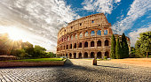 Colosseum in Rome and morning sun, Italy