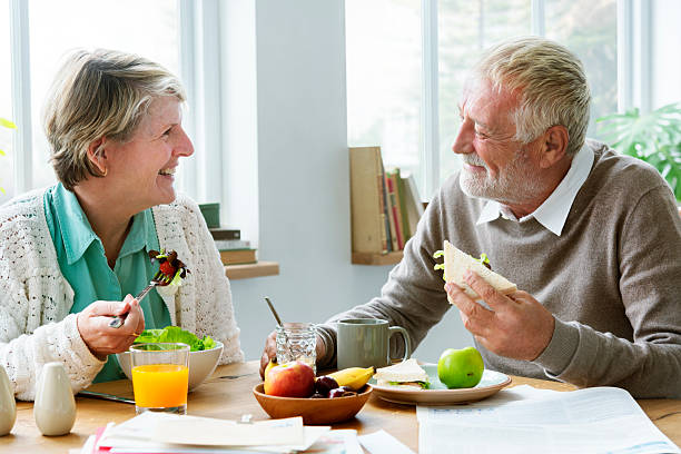 istock Pensioner Elderly Couple Eating Brunch Concept 618335800