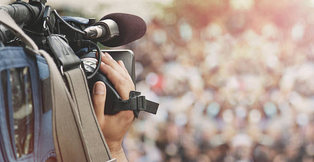 Cameraman shooting crowd Cameraman shooting crowd tv reporter photos stock pictures, royalty-free photos & images