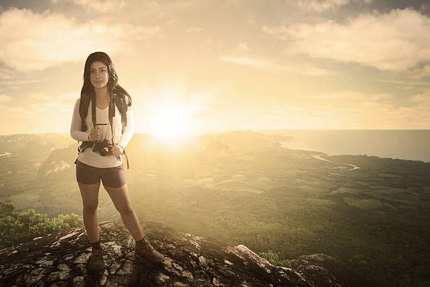 istock Female tourist standing with valley view 618338280
