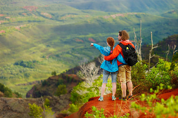 istock Two hikers relaxing enjoying the amazing view 618339164