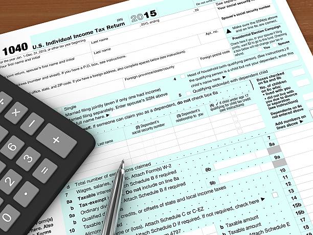 istock Tax form payment desk top view 618340706