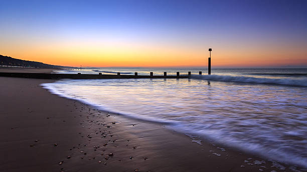 Sunrise in Bournemouth Early morning at Boscombe Beach, Bournemouth, Dorset. boscombe photos stock pictures, royalty-free photos & images